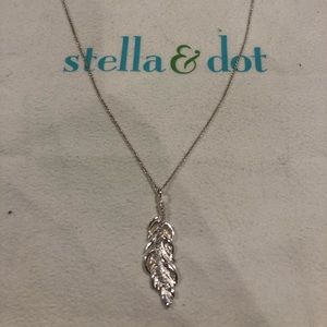 Silver necklace with feather pendant.